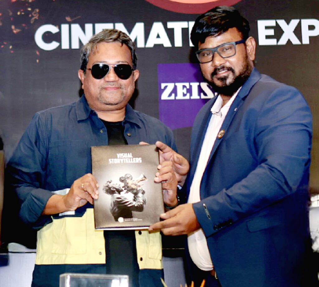 P.G Vinda presents the Visual Storytellers book to legendary cinematographer Sudeep Chatterjee